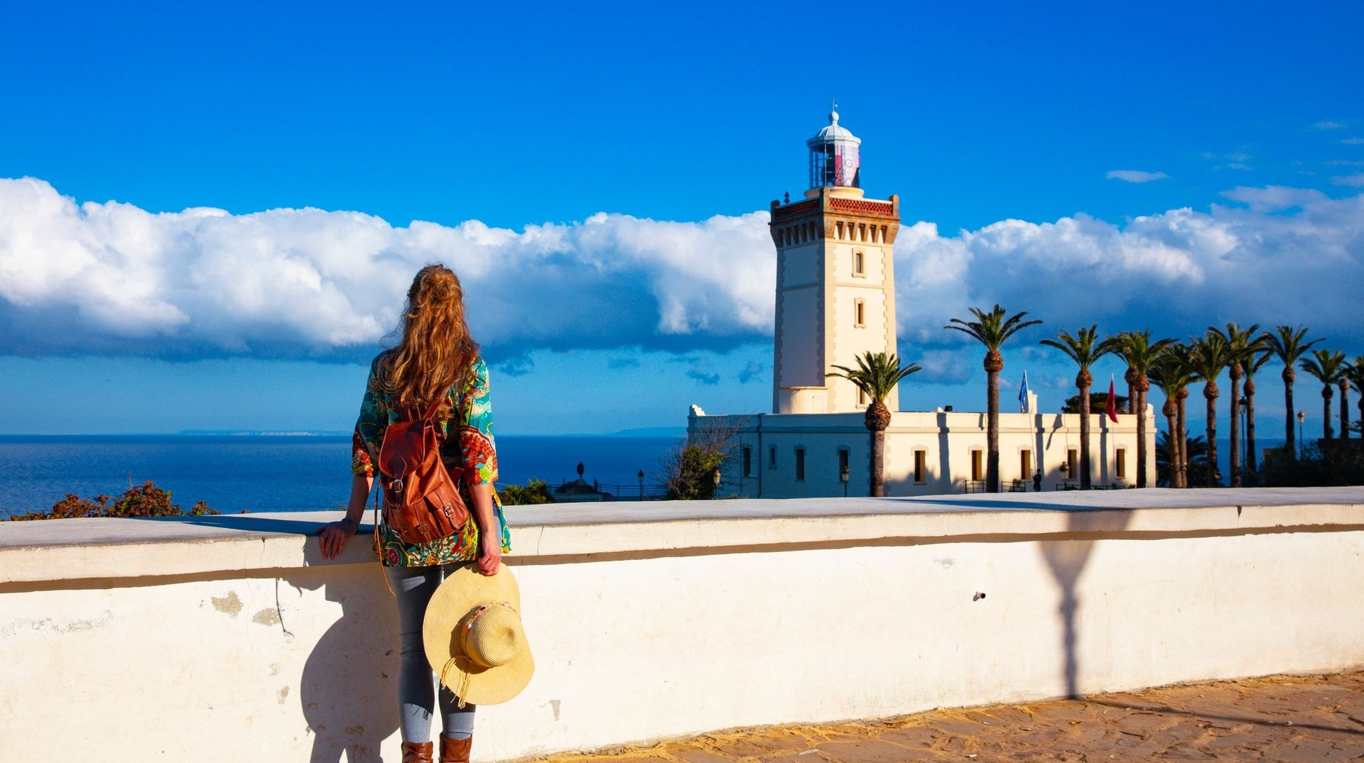 Woman tourist looking at Cap Spartel during her 6 days in Morocco.