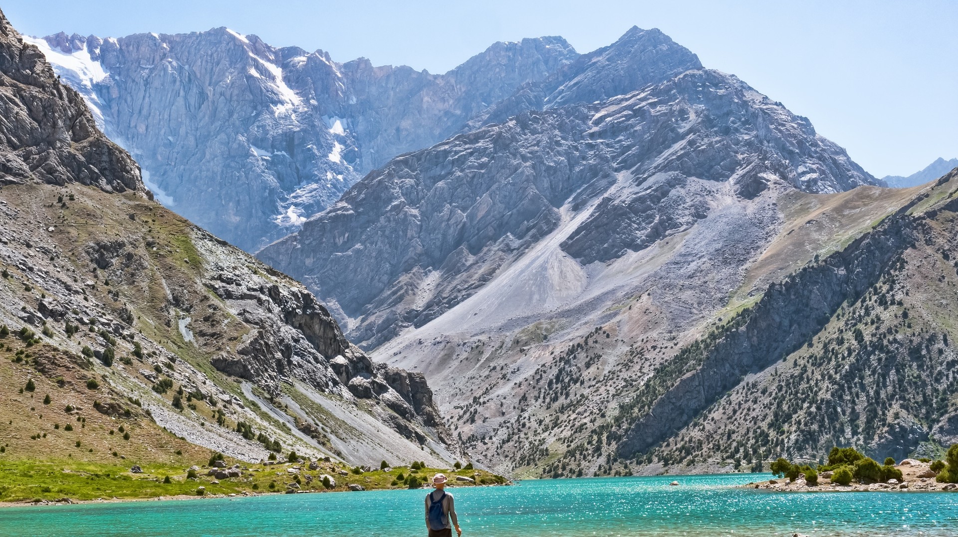 Hiker in Kulikan lake, Best time to visit Tajikistan