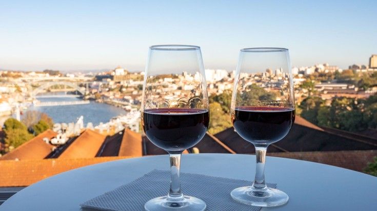 Two wine glasses with Douro River in the background. Two wine glasses with Douro River in the background.