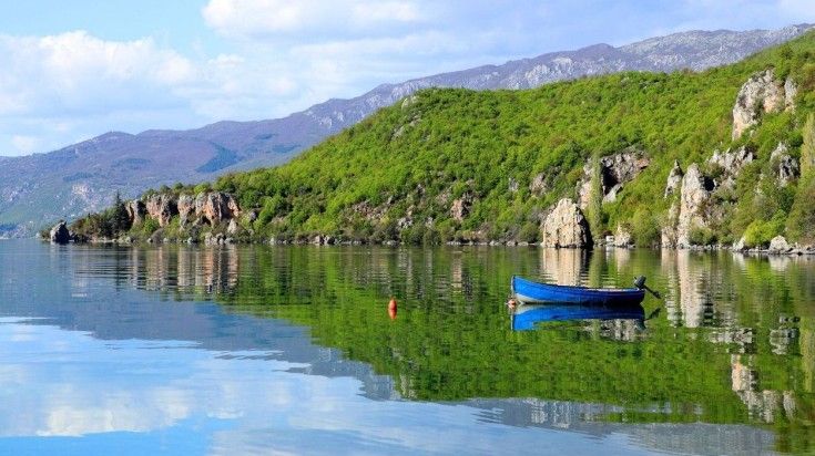 A view of the Lake Ohrid with a small boat near the shore in Macedonia.