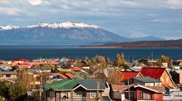 Snow capped mountain behind Puerto Natales on a clear day in Patagonia.