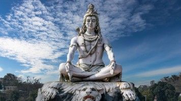 Rishikesh is home to numerous ashrams, which makes it a top wellness destination in India. A statue of Lord Shiva at Rishikesh in India.