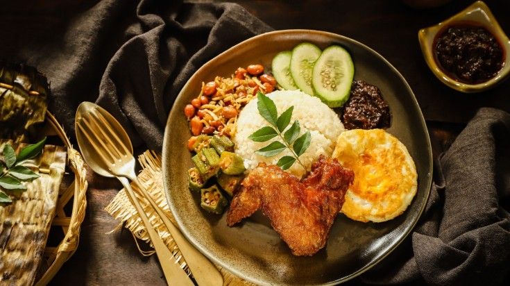 Enjoy Nasi Lemak, a rice dish, while spending 5 days in Singapore.