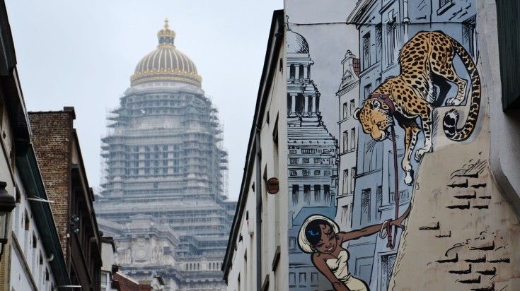 Comic strip mural painting of a girl and a leopard at Brussels.