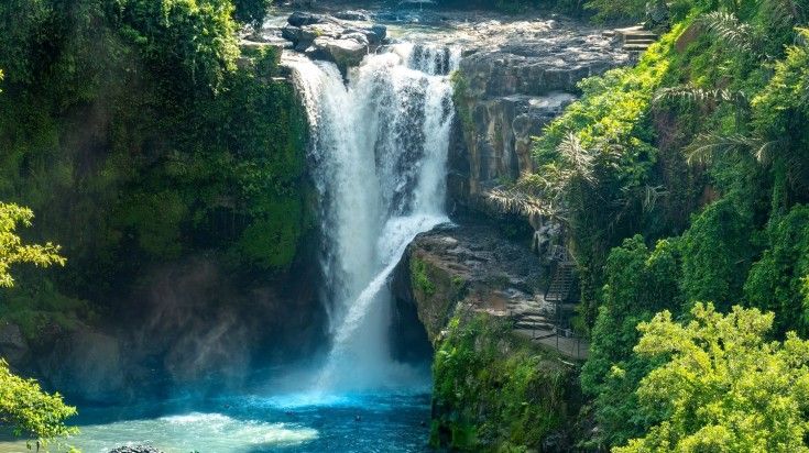 The view of Tegenungan Waterfall on a clear day in Indonesia.