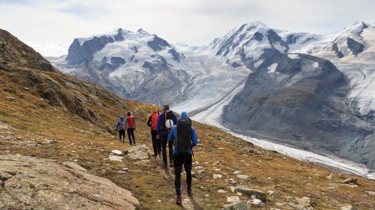 Tourists following the hiking trail in a line at Monte Rosa.