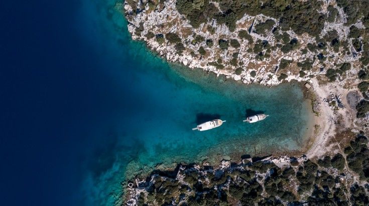 Ariel view of tiny boats at Kekova Bay.