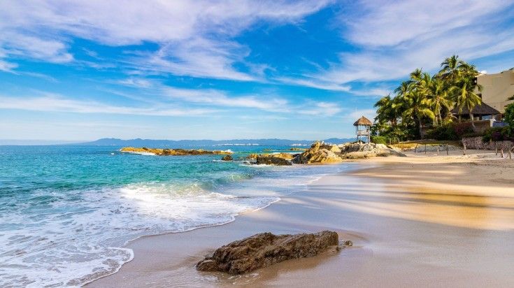 The view of Conchas Chinas Beach on a summer morning in Puerto Vallarta.
