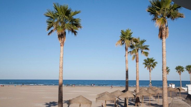 The view of Malvarrosa beach on a clear day in Spain.