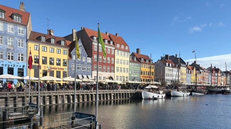 Copenhagen Harbour with colorful waterfront buildings and calm water.