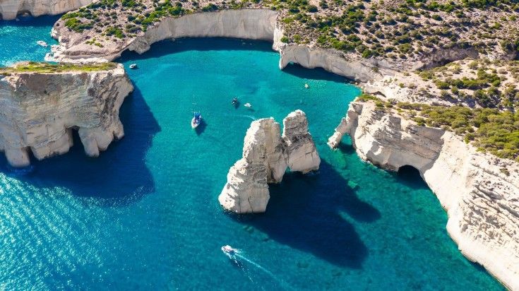 Aerial view of Milos Island with volcanic rocks and caves in Greece. Aerial view of Milos Island with volcanic rocks and caves in Greece.