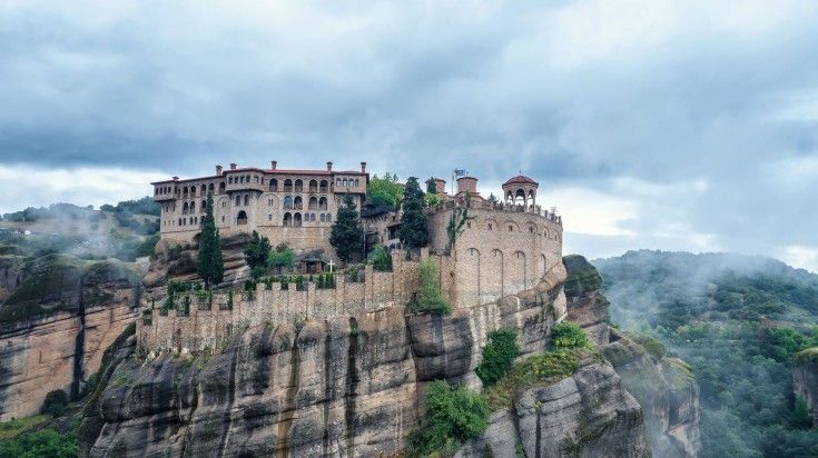 Panoramic view of Meteora Valley on a cloudy day in Greece.