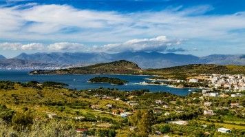 Saranda is a beautiful coastal city in the Albanian Riviera along the Ionian Sea. View of Saranda with Ksamil beach and island in the Ionian Sea in Albania