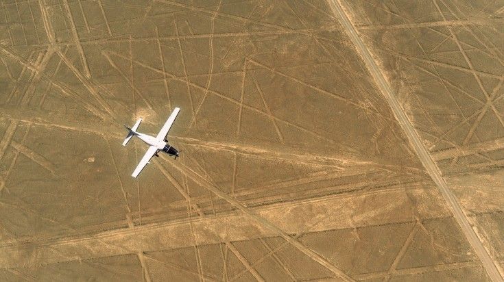 Fly over the pre-Columbian geoglyphs insribed in the South Peruvian desert known as the Nazca lines. An aircraft flying over the Nazca Lines as a part of a 21 day Peru trip.