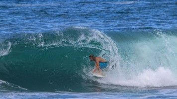 Surfer takes on a wave in the Azores