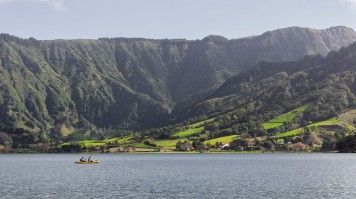 Two people kayak on the lake in Sete Cidades in July