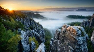 The Bastei is a stunning rock formation located in the Saxon Switzerland National Park in eastern Germany. Witness a stunning foggy sunrise from the rock formations in Bastei.