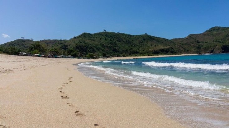 Kuta beach on a sunny day in Indonesia.