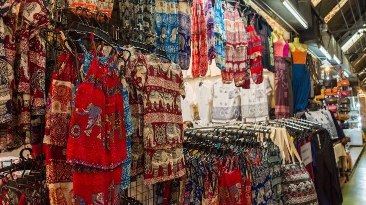 A shop displaying colorful clothes of children in Chatuchak Weekend Market. A shop displaying colorful clothes of children in Chatuchak Weekend Market.