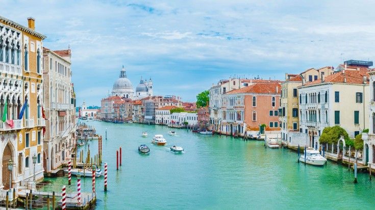 A cruise on the river in Venice during summer. Take a cruise trip in Venice during your 8 days in Europe.