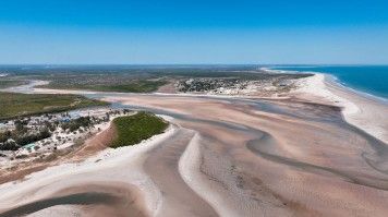 Aerial view of winding, sandy coastline and rivers in Morondava, Madagascar