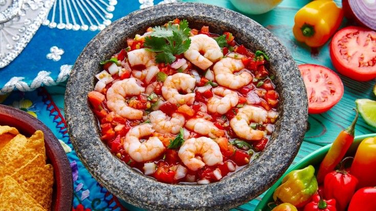 Ceviche de Camaron shrimp molcajete on a table in Mexico. Ceviche de Camaron shrimp molcajete on a table in Mexico.