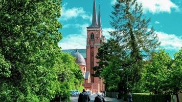 Explore Roskilde Cathedral's rich history, from Viking kings and Gothic architecture to the future tomb of Queen Margrethe II. Visit Roskilde Cathedral during 10 days in Denmark