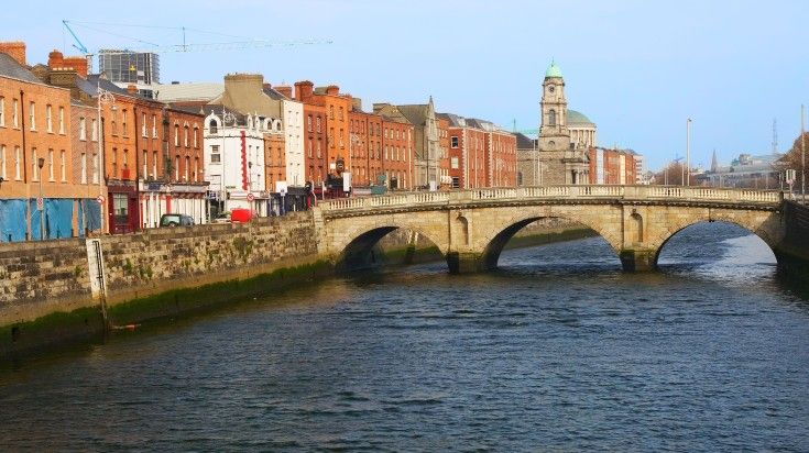 City skyline of Dublin with Mellow Bridge on River Liffey on a clear day. City skyline of Dublin with Mellow Bridge on River Liffey on a clear day.