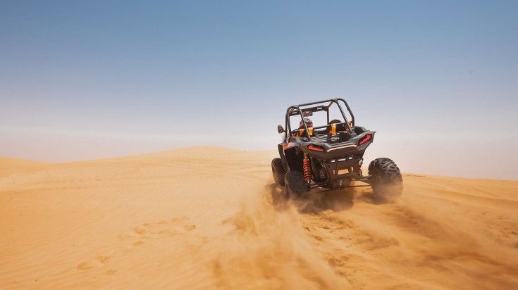 Dune bashing on a quad bike.