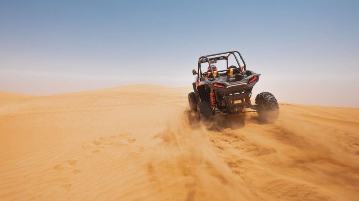 Dune bashing on a utv buggy.