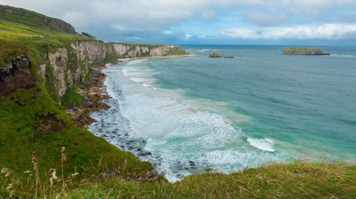A view of Carrick-a-Rede coastal trail in Ballycastle, Northern Ireland. A view of Carrick-a-Rede coastal trail in Ballycastle, Northern Ireland.