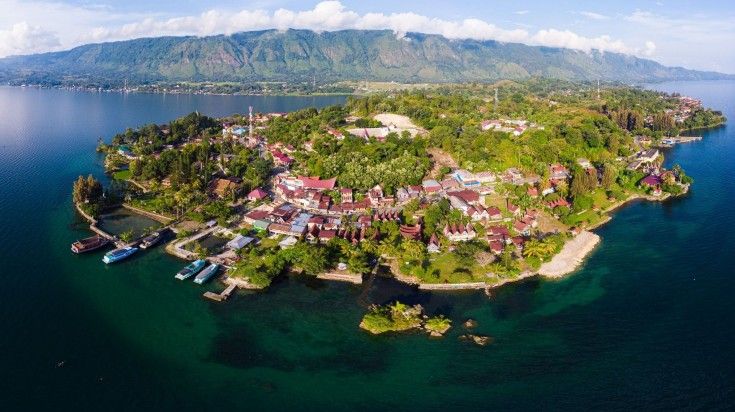 Aerial view of Lake Toba and Samosir Island on a clear day in Indonesia.