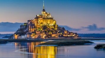 Mont Saint Michel in France illuminated in the evening
