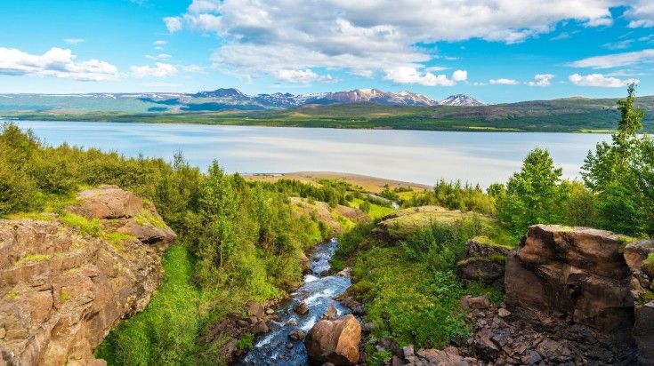 Bask in the serene beauty of  Lagarfljot lake during your 6 days in Iceland