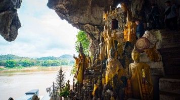 Explore the Pak Ou caves during your 2 weeks in Laos.