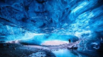 A woman exploring the Vatnajökull Glacier ice caves