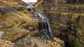Water cascading down Glymur falls.