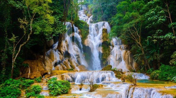 Kuang Si Waterfall, located near Luang Prabang, Laos, is a stunning natural attraction known for its breathtaking beauty. Soak in the stunning Kuang Si Waterfalls while spending 4 days in Laos