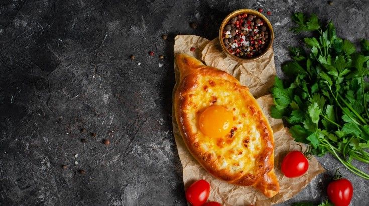 The display of Khachapuri on a table. The display of Khachapuri on a table.