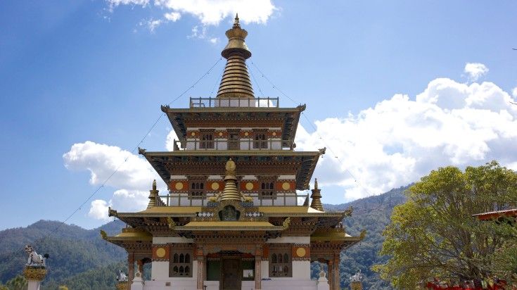 The front view of Khamsum Yulley Namgyal Chorten on a sunny day.