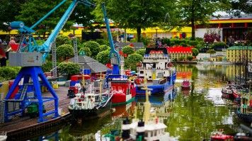 Embark on an epic adventure at Legoland Billund, where imagination runs wild and every brick brings joy and wonder to life, Legoland Billund Resort on a clear day in Denmark.