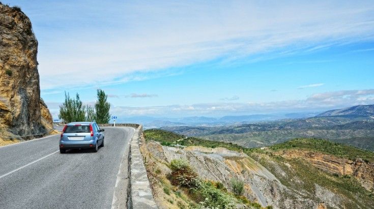 A car traveling to Cordoba on a clear day.