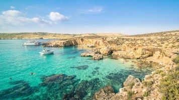 The Blue Lagoon is a bucket-list destination famous for its crystal-clear turquoise waters, rugged cliffs, and a variety of water activities. The Blue Lagoon in Comino Island, Malta is famous for snorkeling & kayaking