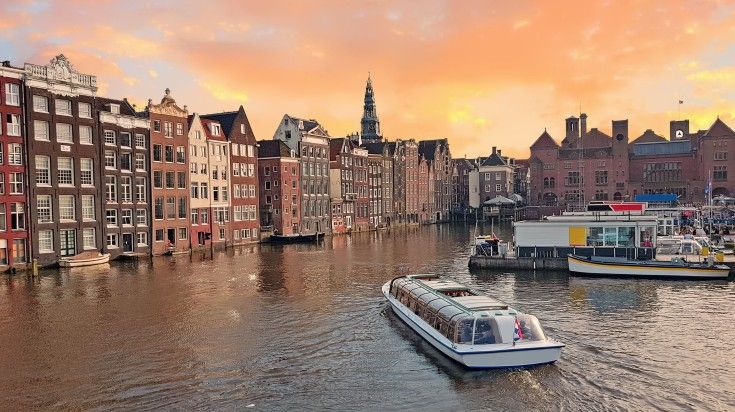 canal cruise in Amsterdam at evening hour