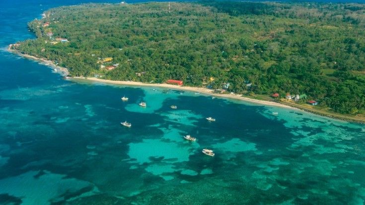 Aerial view of lush Corn Island and the turquoise Caribbean waters