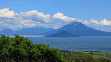 Momotombo is an active stratovolcano that sits on the northern shore of Lake Managua in west Nicaragua. View of Momotombo volcano on the shore of Lake Managua in Nicaragua