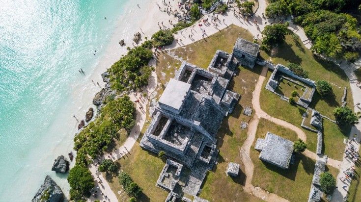 Ruins of Tulum on a sunny day at the beach in Mexico.