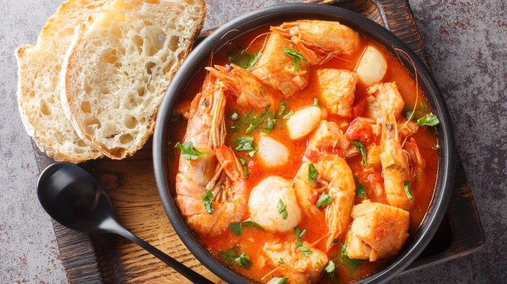 Top view of soup of seafood and white fish with shrimp, mussels in a bowl. Top view of soup of seafood and white fish with shrimp, mussels in a bowl
