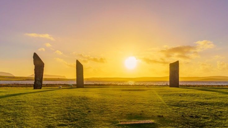 Witness a sunset view of the Standing Stones of Stenness in Orkney Islands.