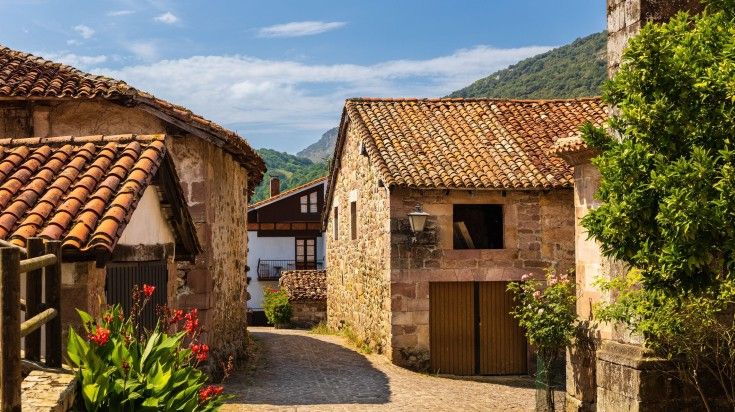 Street of the small town Carmona with traditional rural mountain mansions.